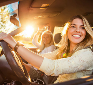 Happy customer driving a new car